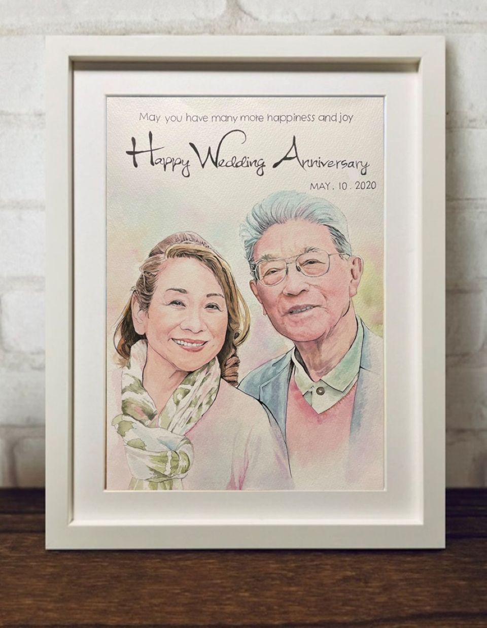 水彩画似顔絵。夫婦の笑顔をイラスト風に水彩の柔らかい色彩でおしれに表現した一点ものの似顔絵作品。